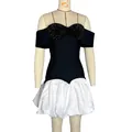 Dettaglio frontale dell'elegante abito nero con paillettes e gonna a bolla bianca satinata - Taglia S / Pantaloni e gonne / Nero