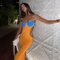 Model wearing a luxury orange bandage dress with blue accents and gold heart hardware - Top And Bottom / S / Orange and Blue