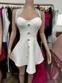 Close-up of white halter party dress featuring rhinestone neckline and decorative buttons. - XS / Tops / White