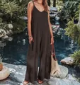 Full view of elegant dark brown ribbed summer jumpsuit presented in a tropical garden - Coffee