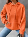Detailed view of bright orange waffle knit hoodie featuring a kangaroo pocket and drawstring hood - S / Tops / Orange