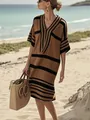 Full-body view of a tan loose-fit striped V-neck dress worn by a model at the beach. - S / Top And Bottom / Dark Brown