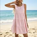 Stylish pink and white gingham sleeveless tiered summer dress captured on a sunny beach - S / Dresses / Pink
