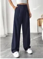 Detailed view of elegant high-waisted navy blue straight-leg trousers for professional wear. - Navy Blue