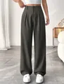 Close-up detail of elegant high-waist straight-leg suit trousers in comfortable dark grey fabric - Army Green