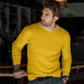 Detail view of yellow men's knit raglan sweater showing the soft texture and fit - Yellow