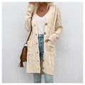 Close-up of a women's long cream cable-knit cardigan with buttons and pockets. - S / Tops / Apricot