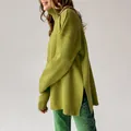 Detail of oversized olive green turtleneck sweater with side split design for women - S / Tops / Olive Green