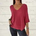Detail of loose-fit V-neck reddish-pink knit top with stylish three-quarter sleeves - S / Tops / Brick Red