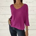 Detailed view of a loose fuchsia V-neck knit sweater with 3/4 sleeves and textured weave. - S / Tops / Rose Red