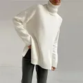 Cozy oversized white turtleneck knitted sweater for women featuring stylish side slits - S / Tops / Milk Apricot