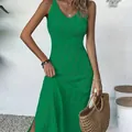 Detailed shot of green sleeveless knitted beach dress with hollow-out pattern for vacation - One Size / Top And Bottom / Green