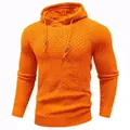 Macro view of bright orange men's hooded sweater featuring waffle knit texture detail - Orange Red