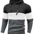 Detailed view of men's color-block hooded sweater with waffle knit texture and drawstrings - Graphite