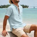 Detail of light blue men's linen beach shirt with Henley collar and chest pocket - Sky Blue