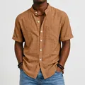 Close-up of a brown linen shirt with band collar and chest pocket details - Earthy Yellow