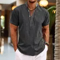 Macro detail of men's dark grey linen short sleeve henley shirt with stand collar - S / Tops / Black