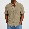 Close-up of a men's khaki short-sleeved linen shirt with a stand-up collar - Grey Khaki