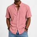 Detailed macro view of a men's salmon pink short sleeve linen shirt with a band collar design - S / Tops / Pink