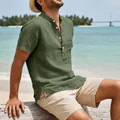 Detail view of green linen men's retro beach shirt with pocket and Henley collar. - Army Green