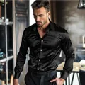 Detail view of a man wearing a premium black shiny mercerized cotton long sleeve shirt - S / Tops / Black