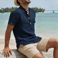Macro view of navy blue linen beach shirt with buttoned henley collar details - Navy Blue