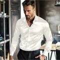Close-up detail of premium white shiny satin men's long-sleeved dress shirt on a model - S / Tops / White