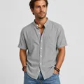 Detail view of a men's gray short-sleeved linen shirt with a stylish mandarin collar. - S / Tops / Gray