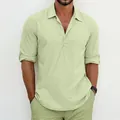 Close-up of men's linen henley shirt in pale green showing fabric texture - Light Green