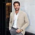 Close-up of men's beige cotton linen blazer with single-breasted lapel for casual style. - Off White