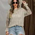 Detail view of beige knit sweater with floral lace sleeves and flared cuffs. - S / Tops / Apricot