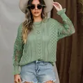 Close-up detail of a sage green lace floral knit sweater featuring elegant flared cuffs - Light Green