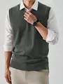 Detailed view of a grey v-neck knitted sweater vest layered over a white shirt for men - S / Tops / Dark Gray
