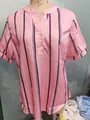 Detailed macro view of pink vertical striped V-neck blouse featuring white button details - 3XL / Tops / Pink