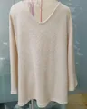 Detailed view of a cream-colored waffle knit V-neck long sleeve sweater on mannequin - S / Tops / Khaki