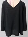 Detailed view of black V-neck knit sweater with vintage hollow waffle texture design - S / Tops / Black
