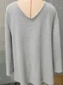 Detailed view of grey waffle knit V-neck sweater on a mannequin showing loose fit texture - S / Tops / Gray