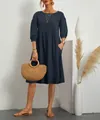 Macro view of navy blue pleated cotton linen dress with lantern sleeves and side pockets. - S / Tops / Navy Blue