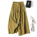 Flat lay view of mustard yellow cotton-linen wide-leg pants with styling accessories - Mustard Yellow