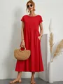 Dettaglio dell'abito rosso a maniche corte in cotone e lino con tasche laterali - Rosso