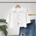 Stylish women's white cropped button-up shirt featuring a front pocket and mid-sleeves - S / Tops / White