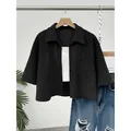 Women's black textured short-sleeved cropped button-down shirt with front pocket detail - S / Tops / Black