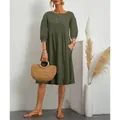 Loose dark green cotton linen dress featuring lantern sleeves and pleated waist detail - Army Green