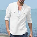 Detail of white cotton linen men's long-sleeved shirt with stand collar and double chest pockets - M / Tops / White