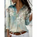 Detail view of the artistic floral print on a long-sleeved V-neck button-up shirt for women - 3XL / Tops / Light Blue Artistic Print