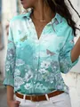 Primer plano de los motivos florali y de mariposas en una camisa turquesa manga larga - 3XL / Tops / Degradado Verde Menta Estampado de Margarita y Mariposa