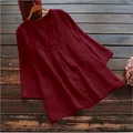 Detailed view of a loose burgundy cotton linen blouse featuring 3/4 sleeves and a V-neckline. - S / Tops / Burgundy