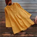 Detailed view of a mustard yellow cotton linen tunic with V-neck and 3/4 sleeves - S / Tops / Yellow