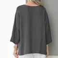 Back view of the loose dark gray linen shirt showing its natural fabric texture. - S / Tops / Gray