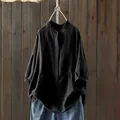 Vista dettagliata di una camicia nera ampia a maniche lunghe con colletto coreano - Taglia S / Top / Nero
